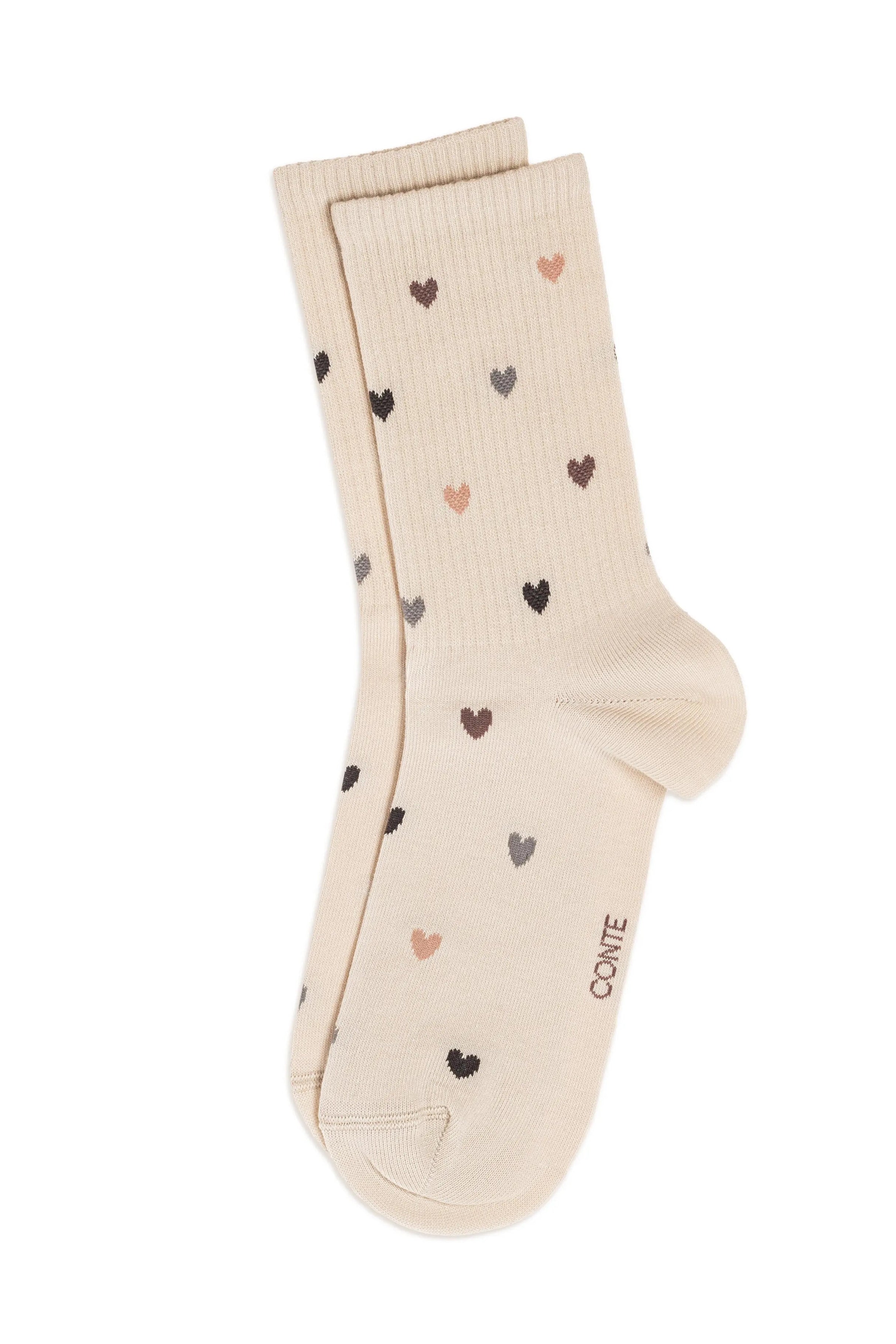 Beige sock with heart patterns on a white background #color_beige