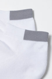 White ankle socks with gray cuffs on a light gray background #color_white