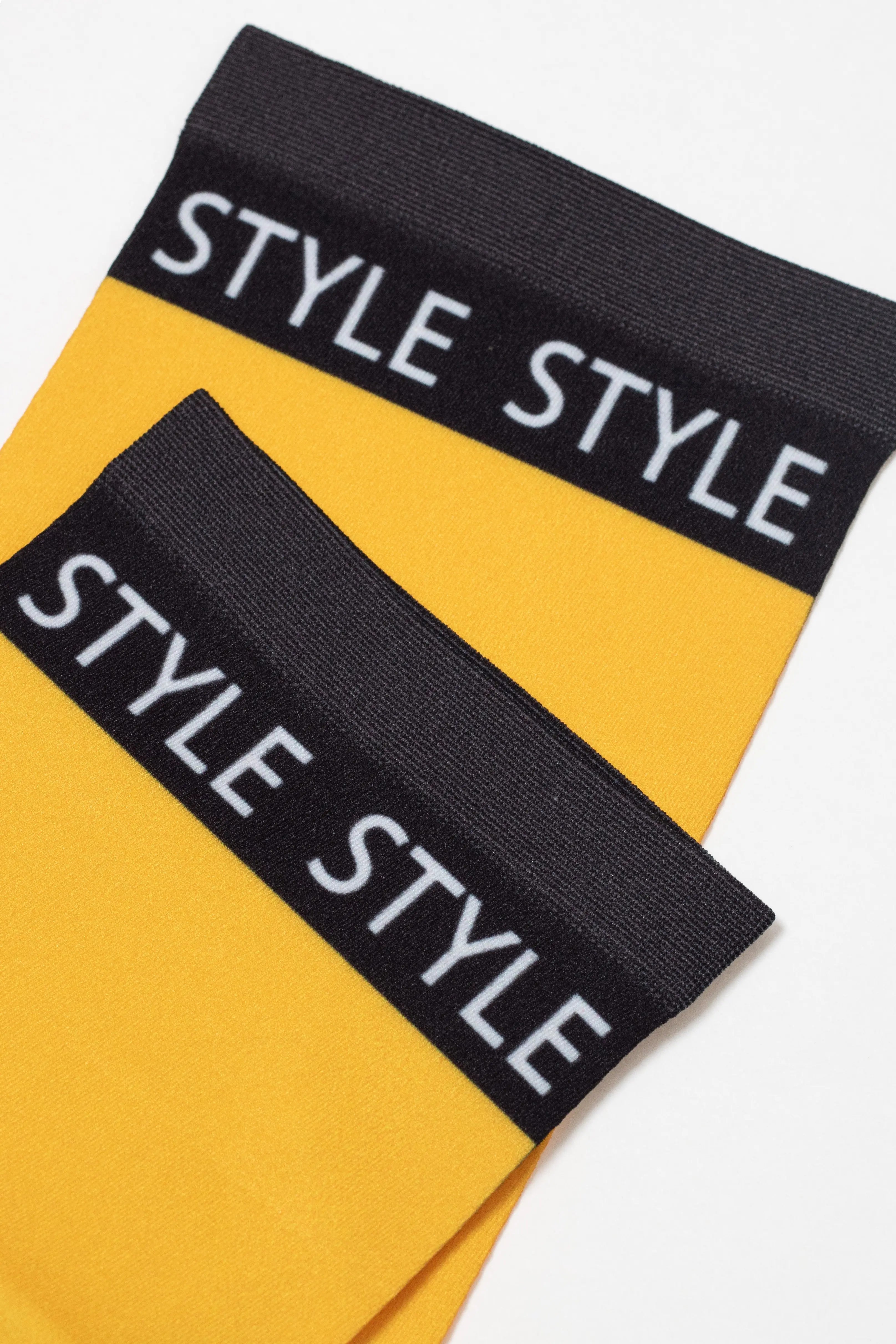 Yellow and black headbands with 'STYLE' text on a white background
