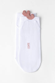 A pair of white ankle socks with a dusty rose pink reindeer antler detail at the top cuff and the brand name 'CONTE' printed in pink on the sole.