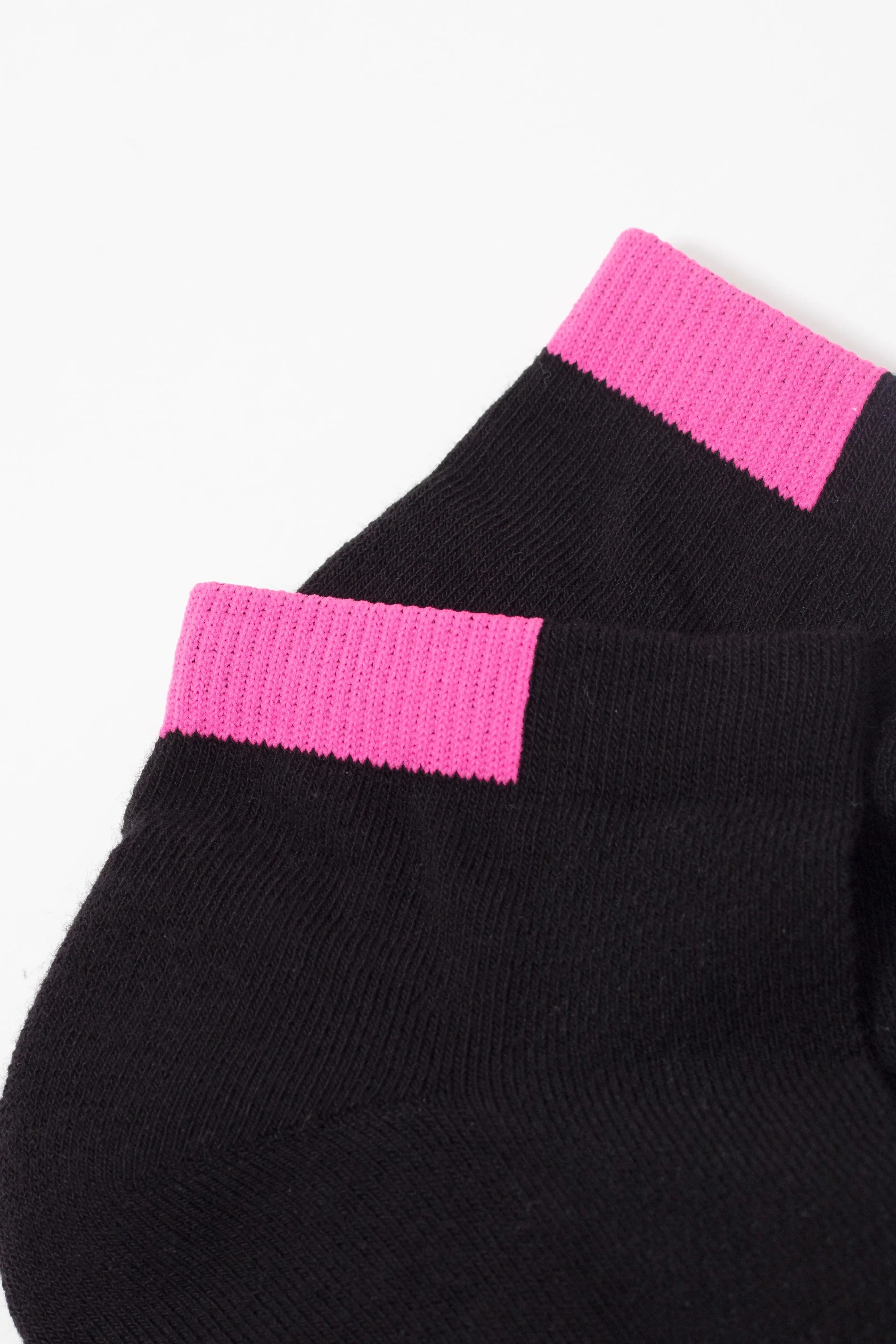 Black sweater with pink ribbed cuffs on a white background #color_black