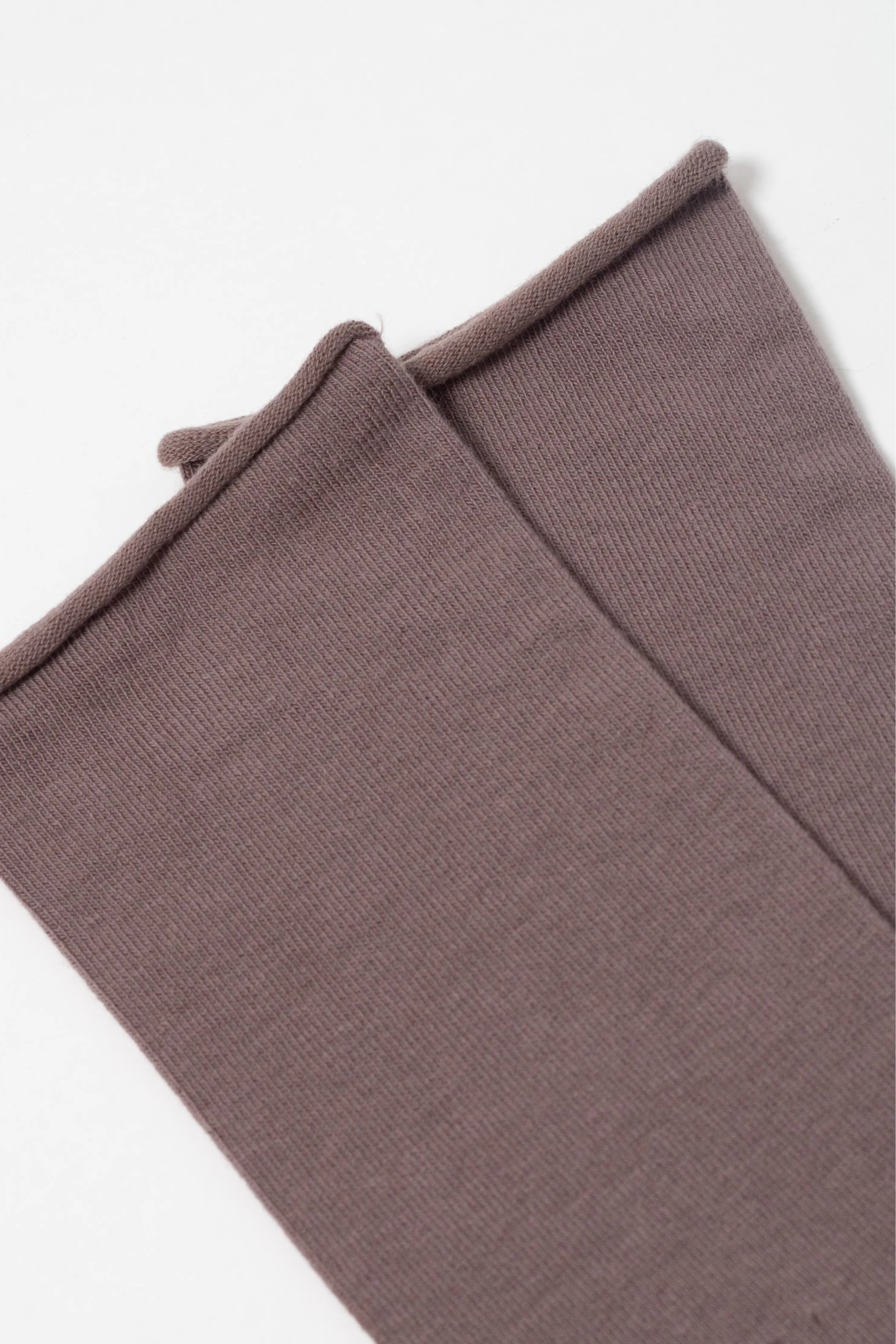 Folded brown fabric on a white background  #color_cocoa