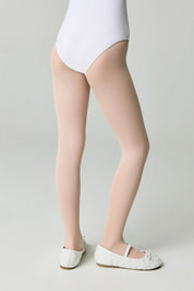 Person wearing a white bodysuit and beige stockings on a plain background #color_pink-ballet