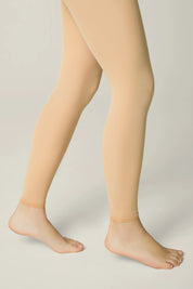 Beige tights worn by a person on a plain background #color_natural-nude