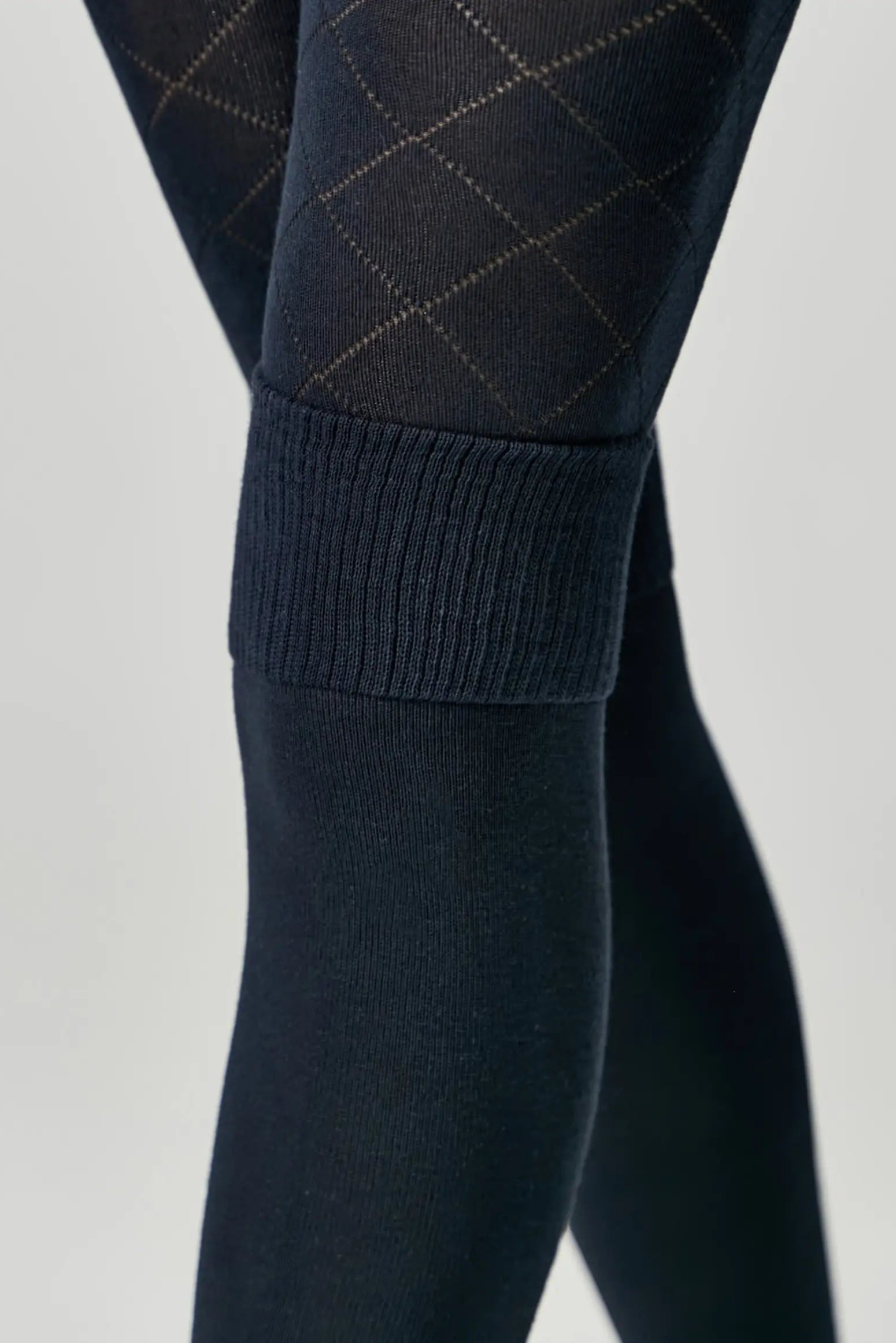 Dark blue tights with a diamond pattern on a light gray background #color_dark-blue