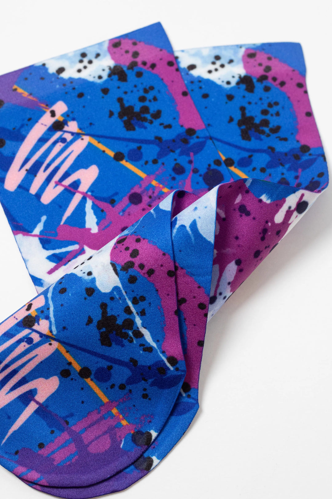 Colorful abstract patterned socks on a white background