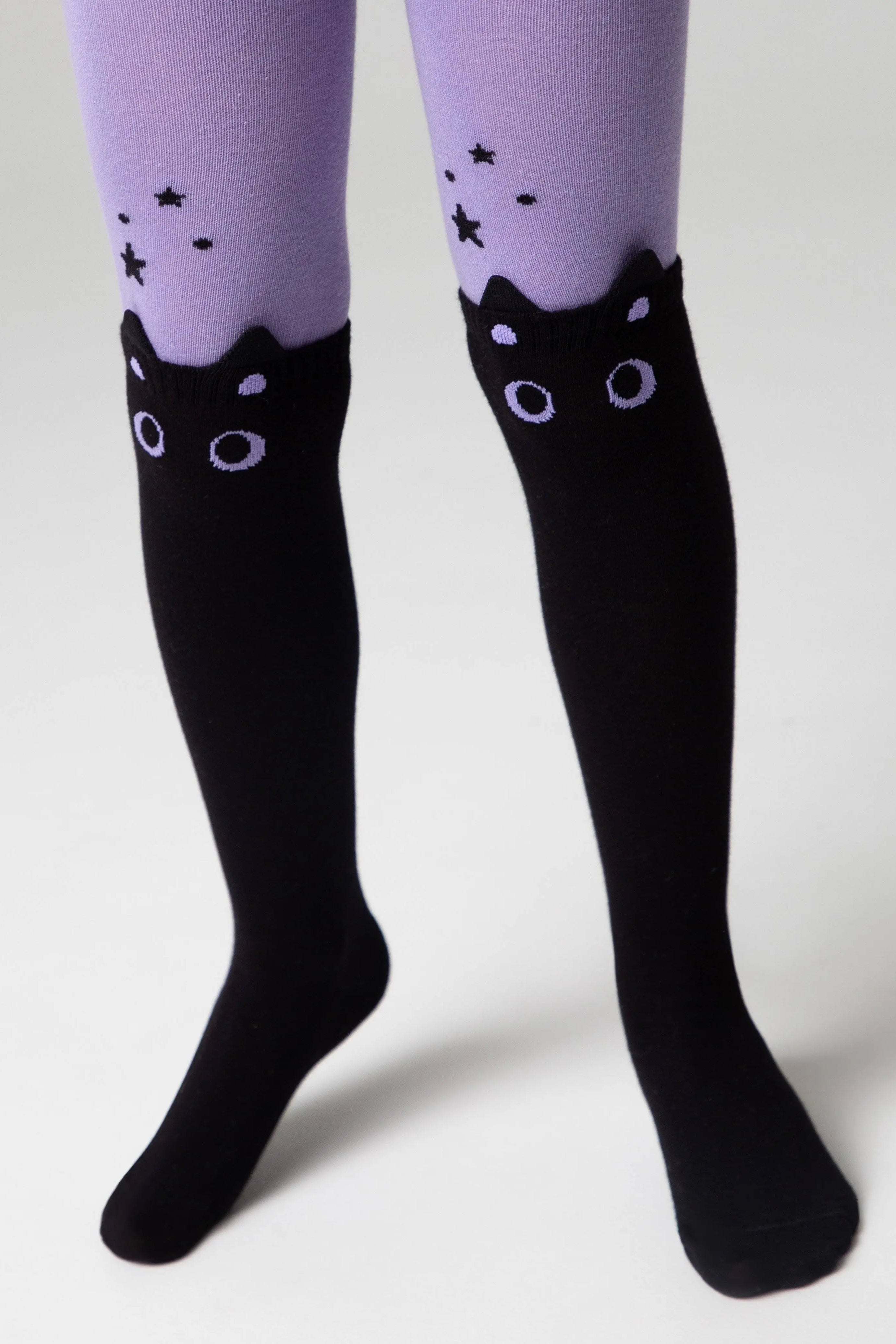 Black knee-high socks with cat ear designs on a white background