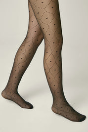 Brown tights with a subtle pattern worn by a person on a plain background #color_nero-black