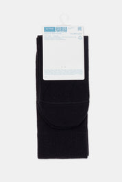 Folded black socks with a label on a white background #color_black
