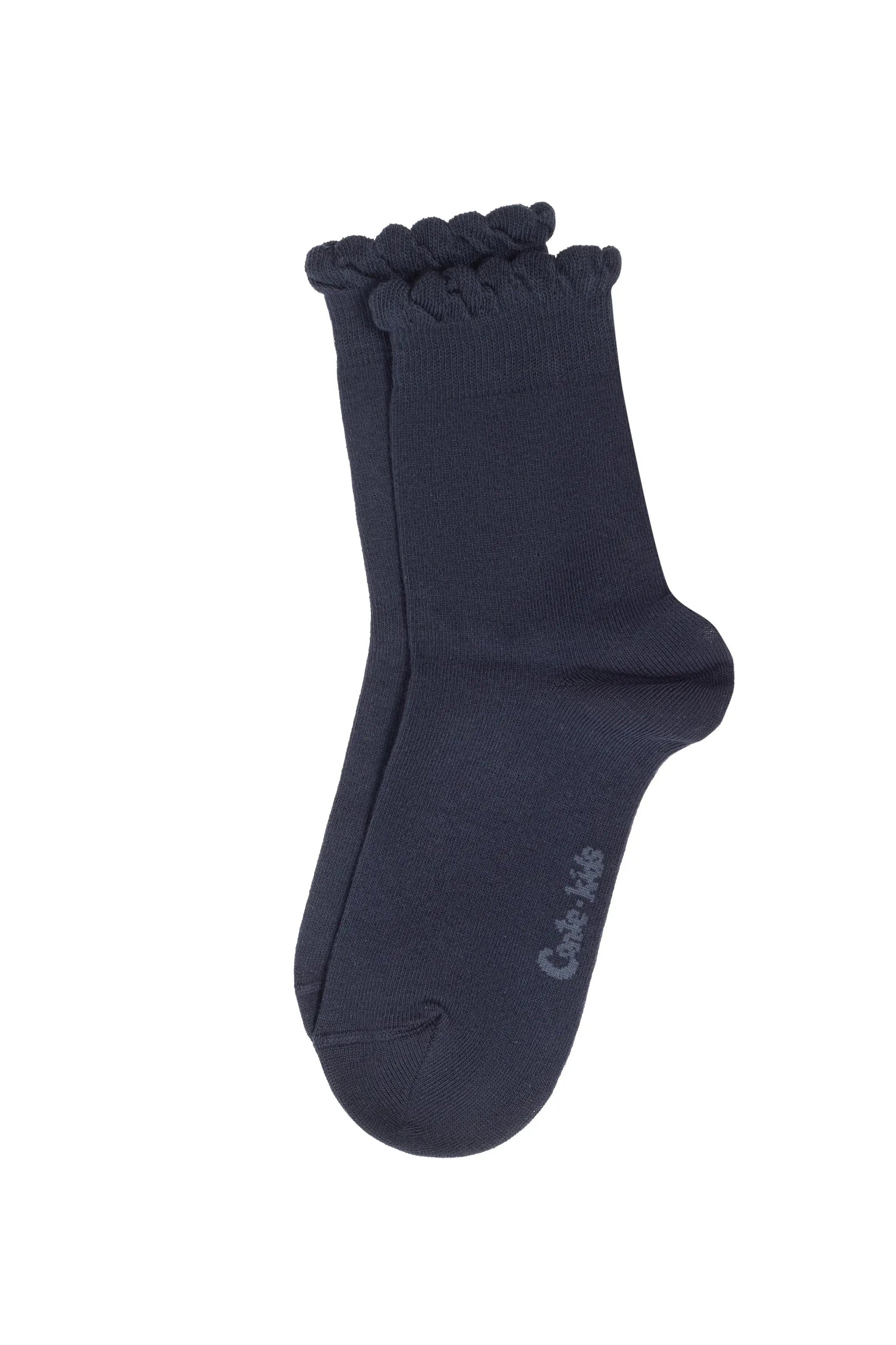 Navy blue sock with ruffled top on a white background #color_dark-blue