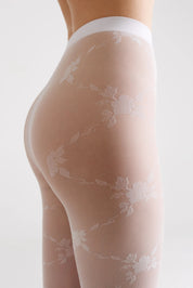 Sheer stockings with floral patterns on a white background