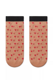 Pair of socks with heart pattern on a white background #color_natural-nude