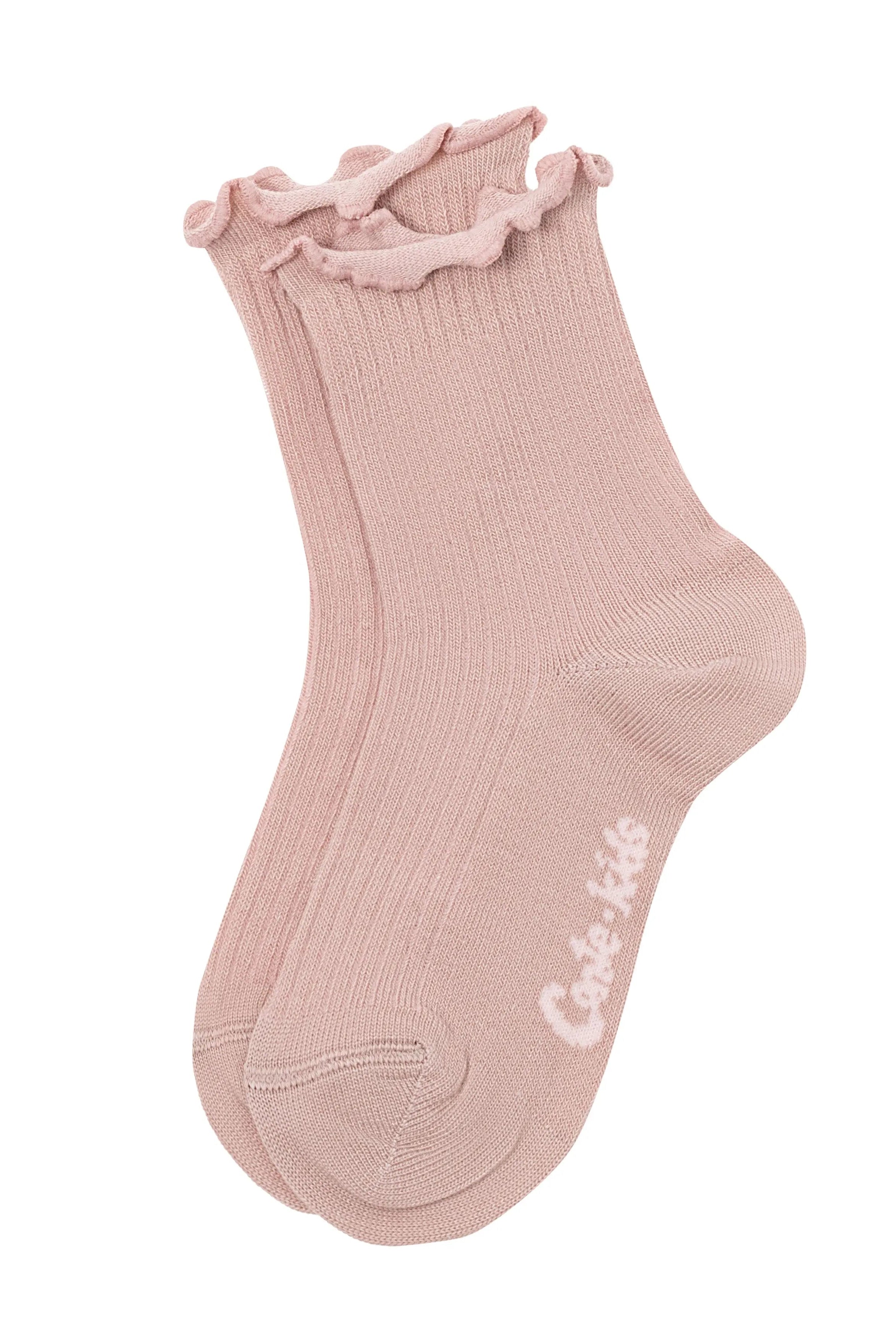 Pink sock with ruffled top on a white background #color_ash-pink