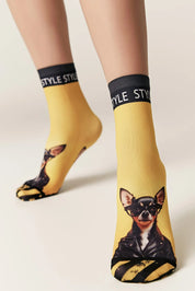 Yellow socks with dog print and 'STYLE' band worn by a person on a light background