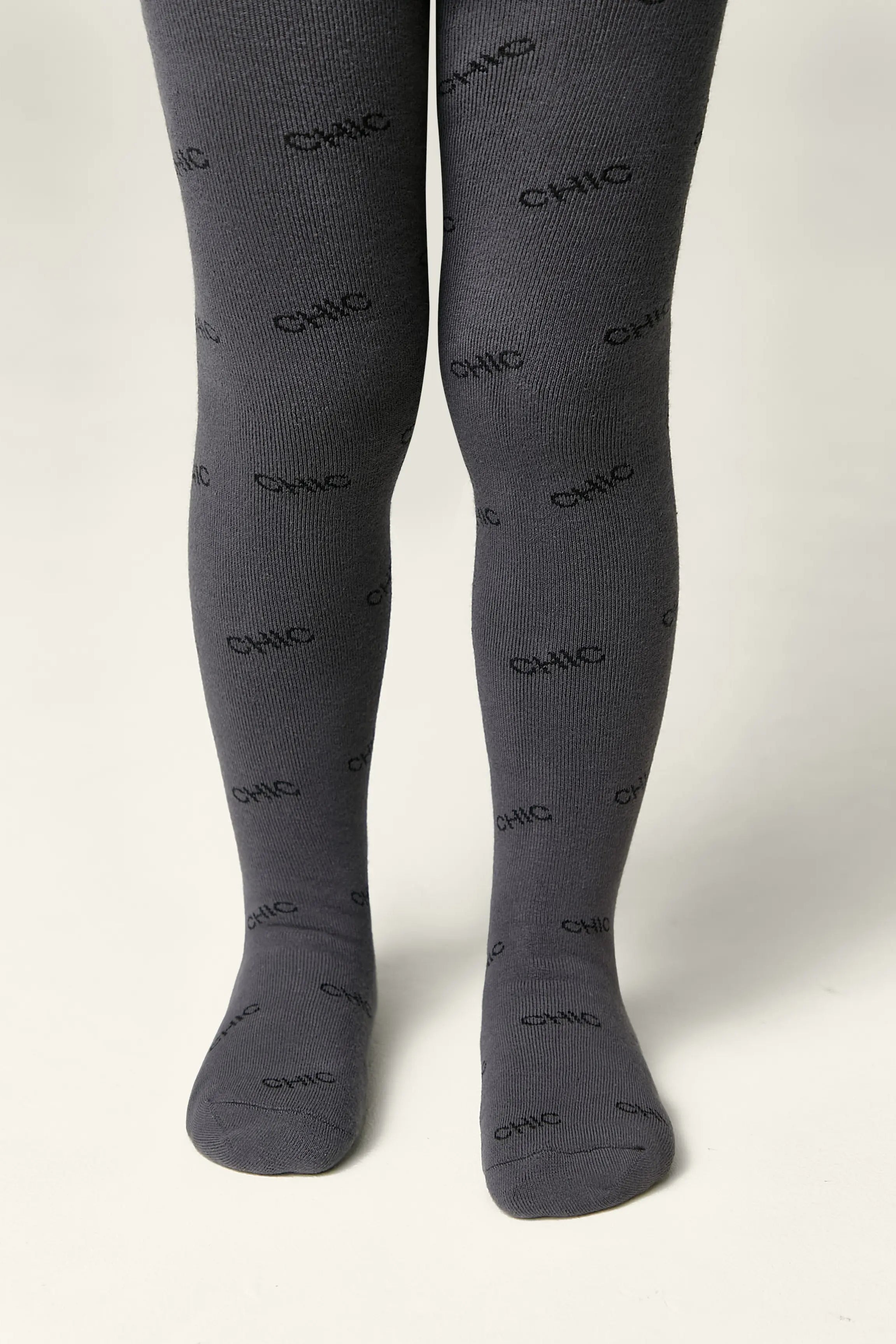 Dark gray tights with 'CHIC' print on a white background #color_dark-gray