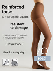 A model's lower body wearing sheer brown hosiery, shown from the waist down against a light gray background. Text on the left reads 'Reinforced torso IN THE FORM OF SHORTS', 'resistant to damage', 'LIGHTNESS AND COMFORT THROUGHOUT THE DAY', 'Classic model', and 'ideal for every day'.