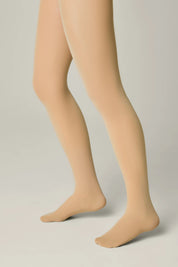 Beige tights worn by a person on a plain background #color_natural-nude