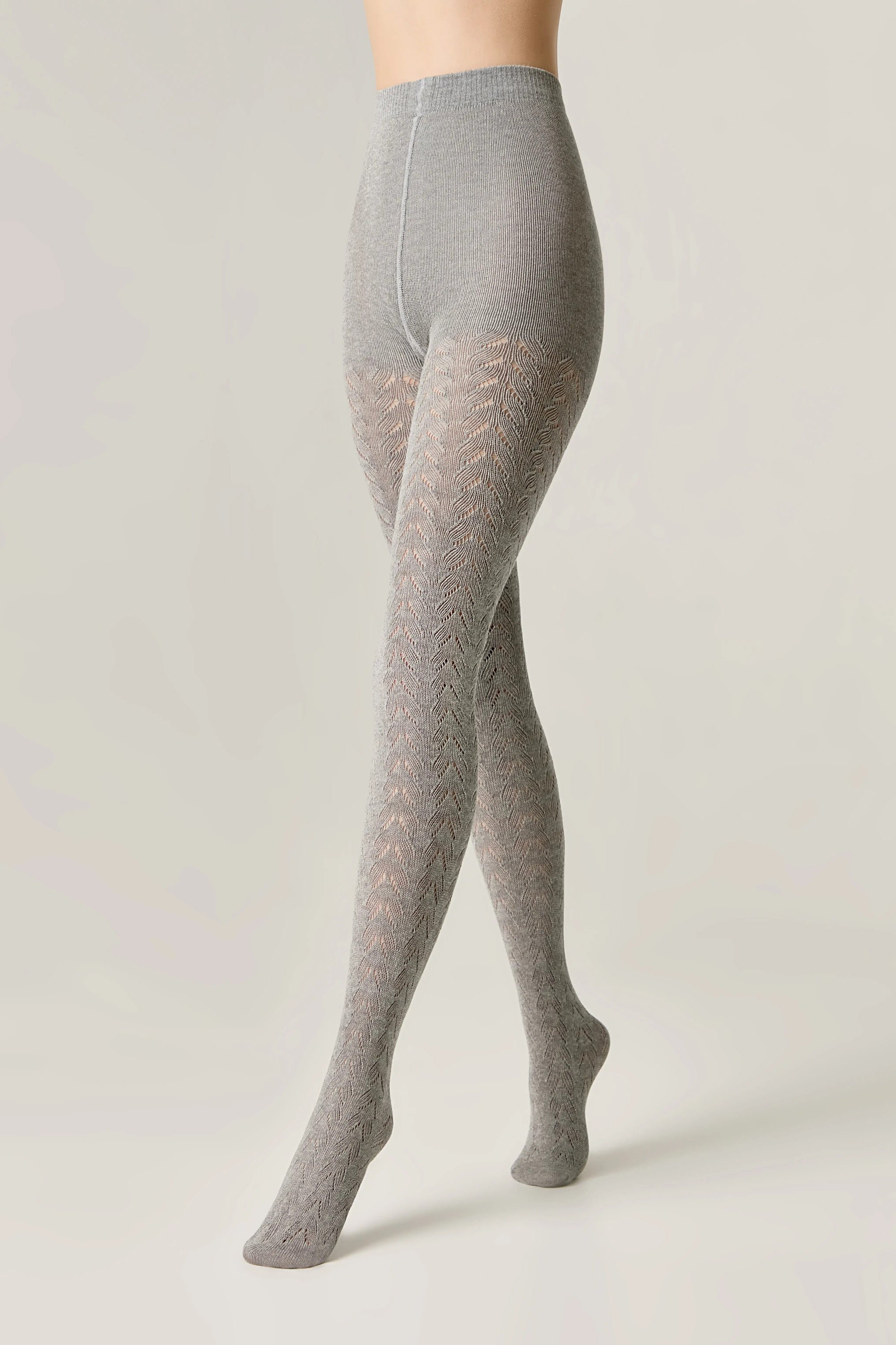 Gray tights worn by a person on a plain background #color_grey