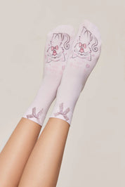 White socks with cat designs on a light gray background