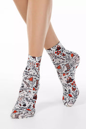 Patterned socks worn by a person on a white background