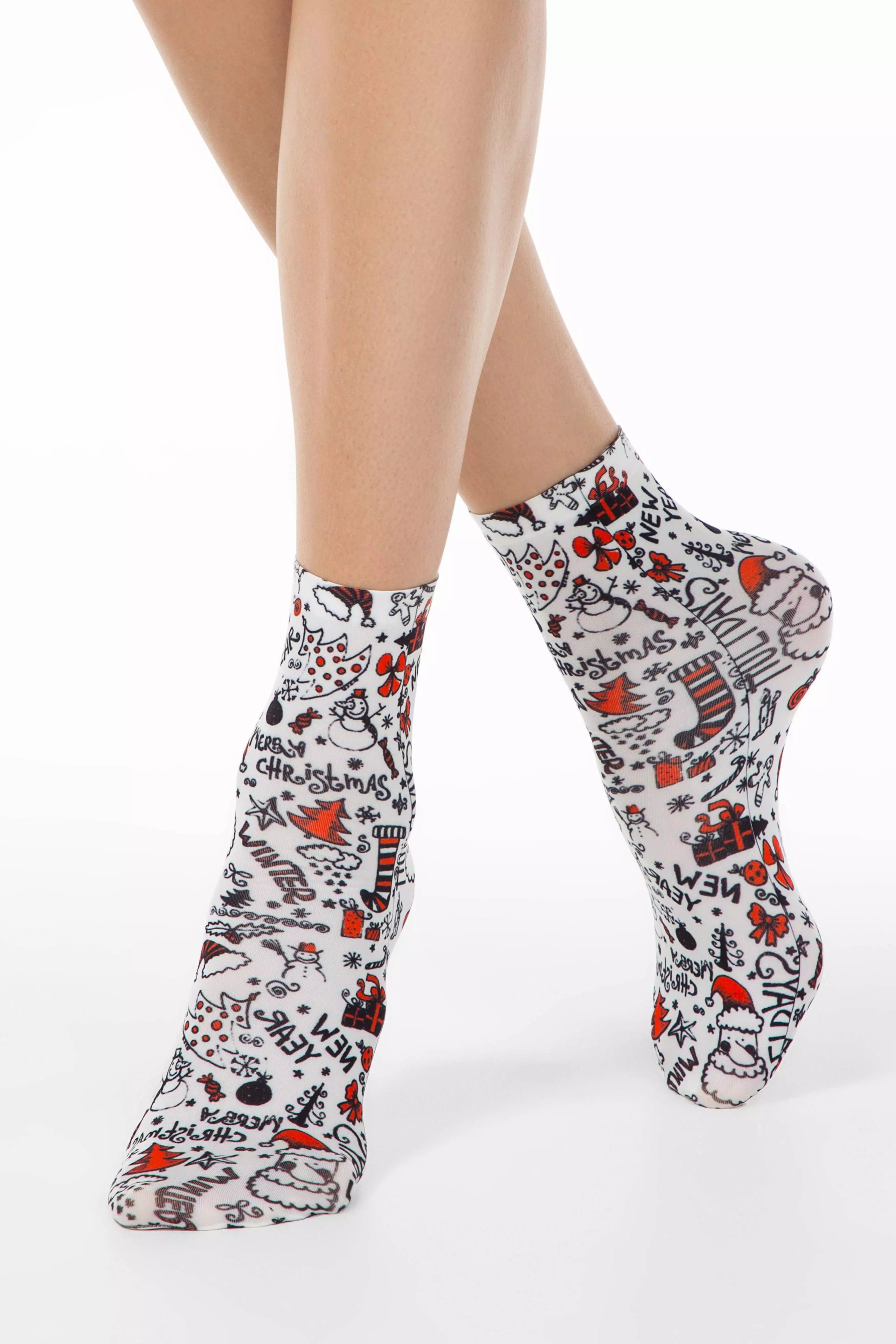 Patterned socks worn by a person on a white background