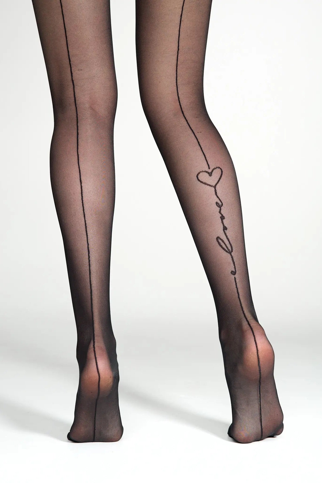 Black sheer tights with 'Elle' branding on a white background