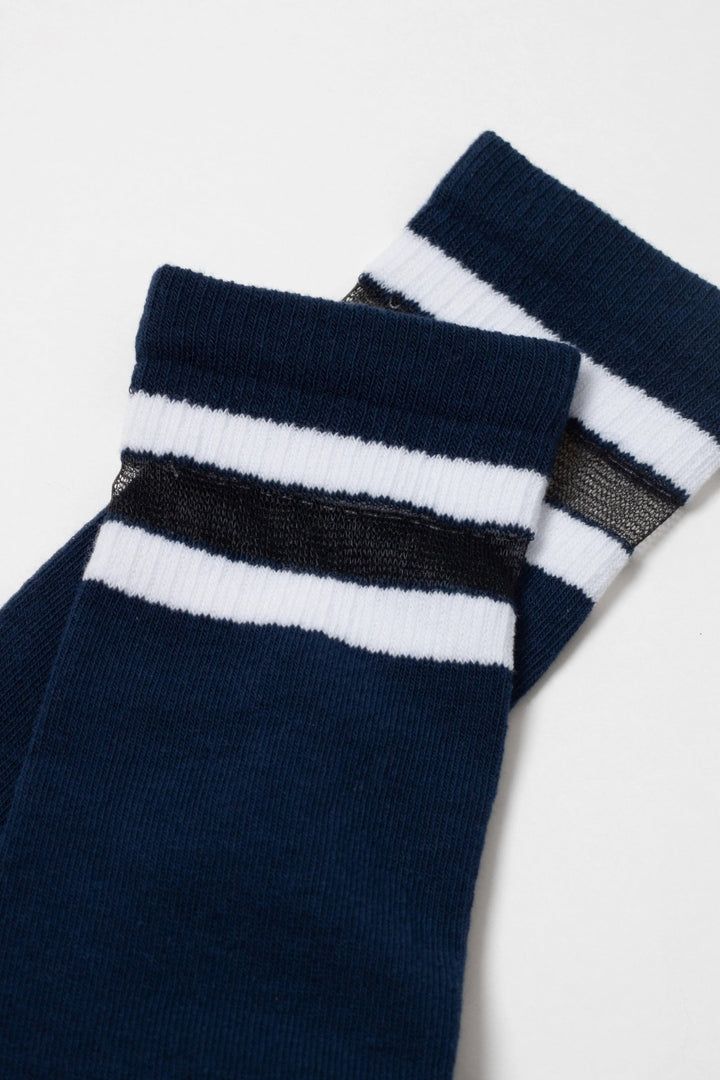 Pair of navy blue socks with white stripes on a light gray background #color_dark-blue