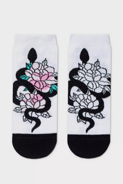 Pair of socks with snake and floral design on a white background