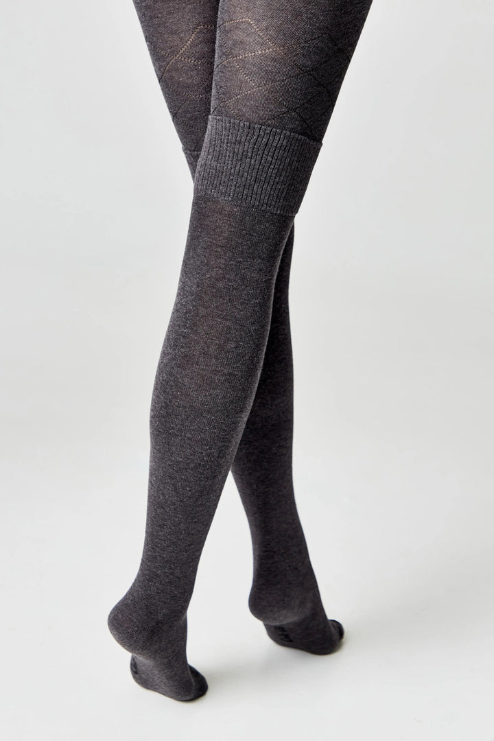 Dark gray tights worn by a person on a white background #color_dark-gray