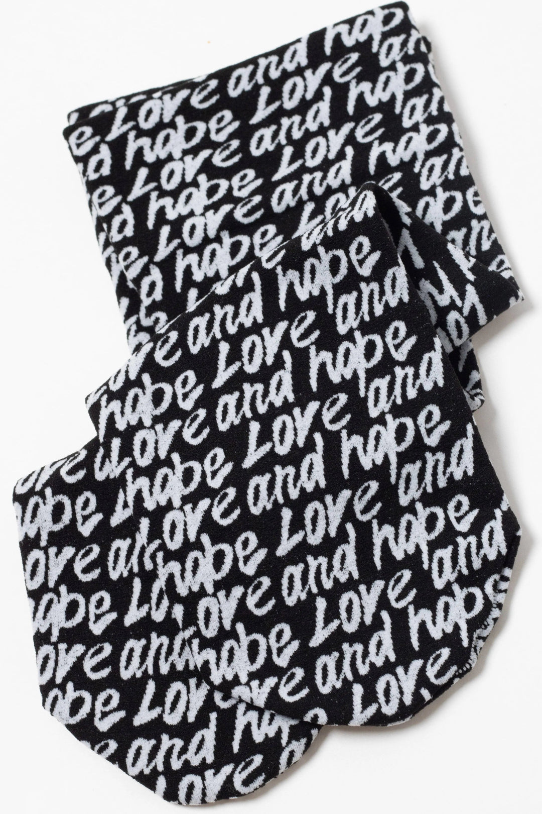 Black and white patterned socks with 'love and hope' text on a white background #color_nero-bianco