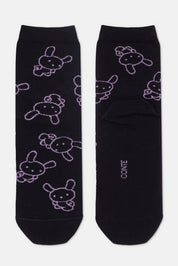 Black socks with purple animal patterns on a white background