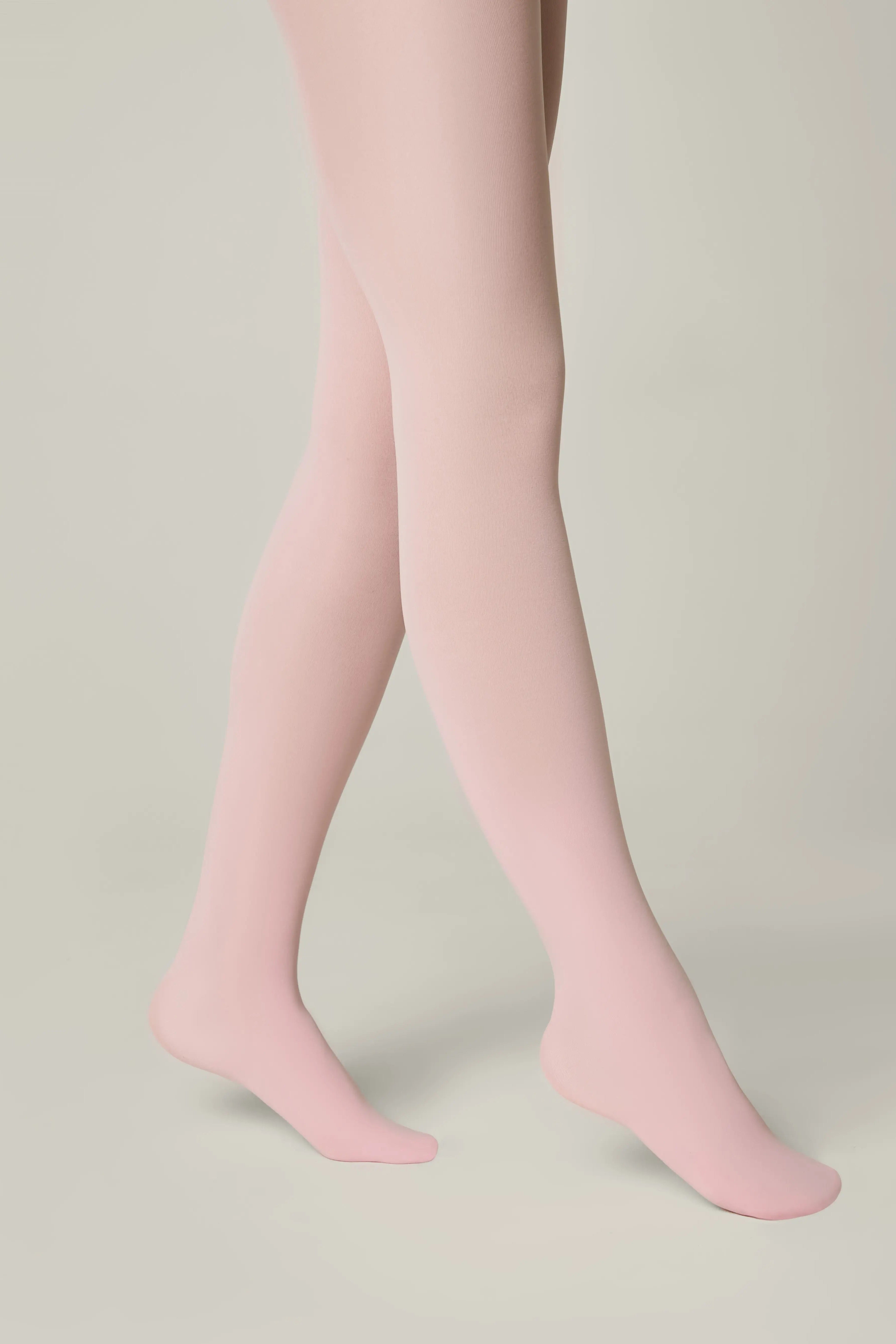 Pink tights worn by a person on a neutral background #color_pink